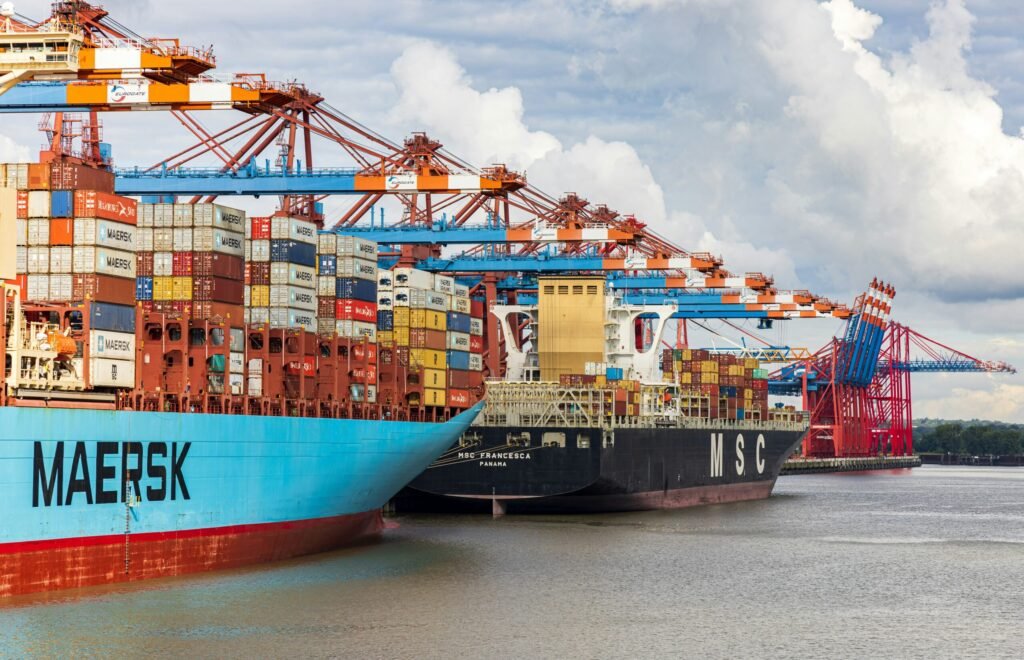 Container ship berthed at a busy port