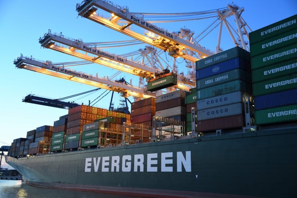Evergreen container ship under port cranes