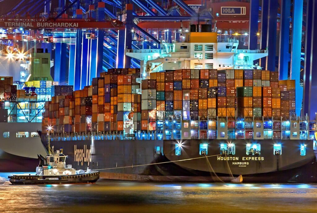 Container ship being worked at a port terminal at night